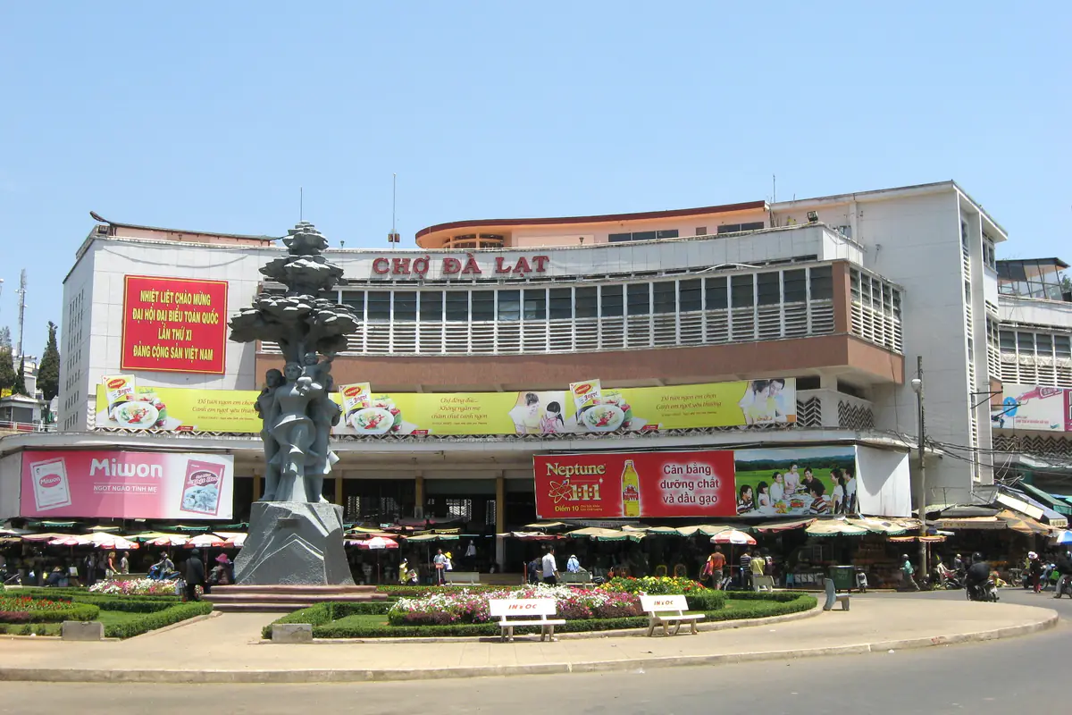 Da Lat Market seen from above, with rows of tin-roofed stalls and the lane between the market buildings