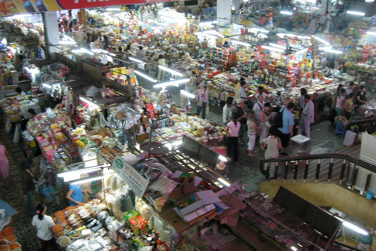 Looking down from the upper floor onto the dried-goods section of Han Market, Da Nang, in May 2009: hundreds of stalls with sweets, candied fruit and dried seafood under fluorescent lights